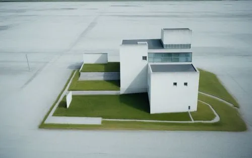 Realistic image replaces the brown color replaces it with grass, maintain contour lines, White concrete buildings,an island with grass that is growing on top of it,bentwaters,tilt shift,spaceports,ksc