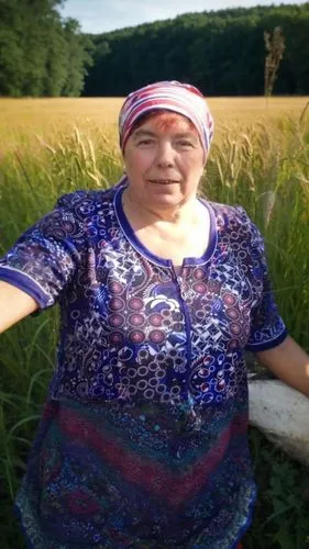 a woman in a field with a scarf on,rigoberta,campesina,uzbek,mapuche,bosniak,varda,bosniaks,ulitsa,biljana,maramures,belarussian,belarusian,marshrutka,woman of straw,belarusians,hayati,kaczynska,abkha