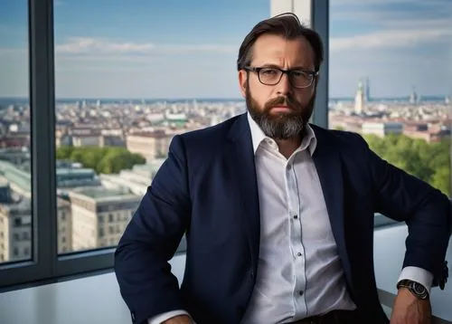 Middle-aged man, certified Heroku architecture designer, serious facial expression, black-rimmed glasses, short brown hair, beard, white button-down shirt, dark blue blazer, fitted trousers, black lea