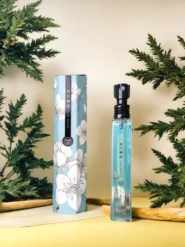 a tube of perfume is next to the package,perfume bottles,colognes,perfume bottle,christmas scent,christmas packaging,fragrances