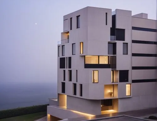 set the cars 
make black walls to concrete 
show street 
,a building with many windows near the beach,dwarka,antilla,cubic house,penthouses,dunes house,modern architecture,lodha,cube house,fresnaye,es