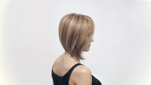 beautiful smooth skinned woman with nice body and black t-shirt with bob haircut,a wig that is very short, blond, with one side cut,promax,premaxillae,braide,praxair,goldwell,keratin