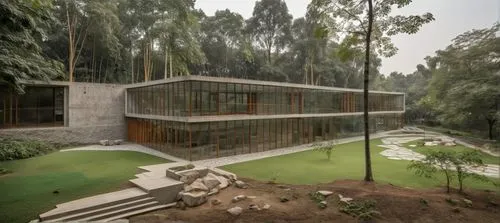 the view from outside of the building in a wooded area,forest house,house in the forest,residential house,aviaries,mid century house,timber house