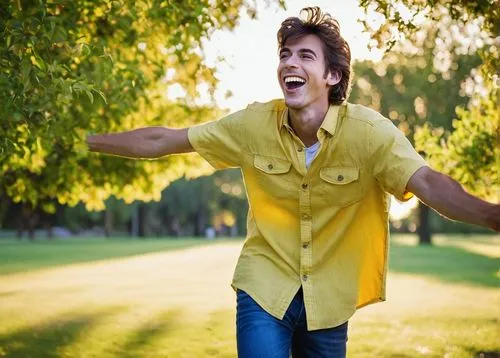 Goofy, Ahh, excited expression, big smile, bright eyes, messy brown hair, casual wear, yellow shirt, blue jeans, sneakers, standing, energetic pose, outdoor, sunny day, green grass, trees in backgroun