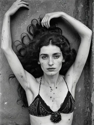 Black and white portrait of a pale, lower-class gypsy woman with blemished and blotchy skin who is in a trance. She has never shaved her dark underarm hair, which is very noticeable. The overall impre