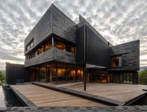 designed by frank Lloyd wright, black facade, concrete, glass,cube house,cubic house,modern architecture,modern house,house by the water,wooden house,dunes house,house with lake,timber house,cube stil