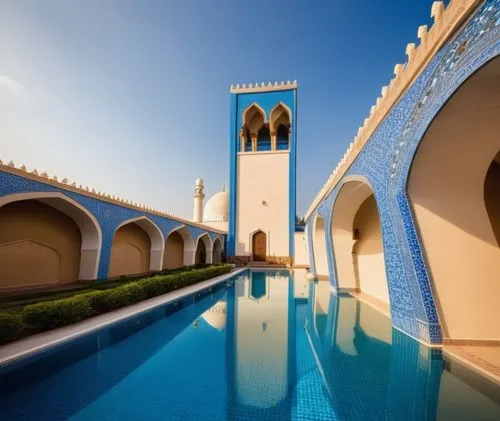 modern mosque with afternoon vibe, blue sky and birds on it. beautiful form and tileworks on walls, modern form of minaret and dome. the pool in the middle of entrance of mosque. attractive form and d