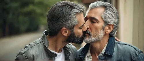 Mature, gay, couple, intimate, romantic, tender, kiss, gentle, soft focus, warm lighting, natural makeup, gray hair, beard, casual wear, jeans, plain white shirt, leather jacket, relaxed posture, lean