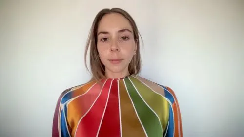 a woman has a colorful top on her neck,color fan,colorama,polychromed,bodypainting,chrominance,vestibular