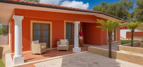 UNA CASA ESTILO MEXICANO, CON COLORES VIBRANTES, USO DE CANTERA,PISOS DE BARRO ROJO, TABIQUE Y ELEMENTOS REGIONALES MEXICANOS, UBICADA EN UN ENTORNO CAMPIRANO, CON COLUMNAS CIRCULARES DEE CONCRETO, AR