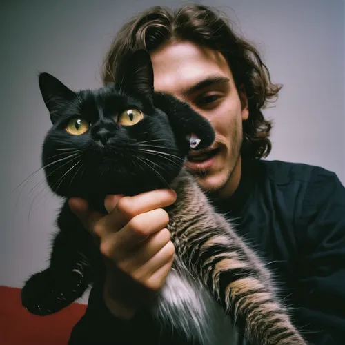 Make a meme with the text 'Me: *tries to take a cute selfie with a cat* Cat: *turns into a demon*',ritriver and the cat,two cats,pet black,human and animal,pet,cat lovers,figaro,vintage cats,domestic 