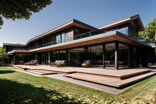 The primary exterior color is black,timber house,modern house,wooden decking,modern architecture,wooden house,dunes house,corten steel,wood deck,frame house,residential house,cube house,cubic house,ho