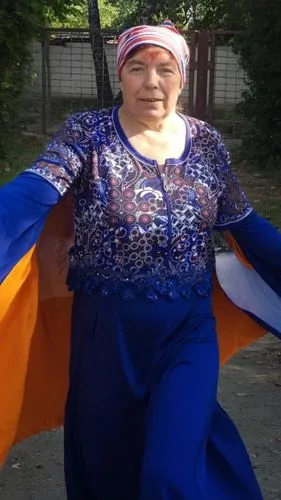 a lady in a bright dress and head wrap,rigoberta,uzbek,mataji,lavani,bhanwari,mapuche,hijras,azerbaijanis,uzbeki,irani,azerbaijani,rajavi,bhangra,sarojini,kyrgyzstani,sukmawati,dagestan,uzbekistani,ma