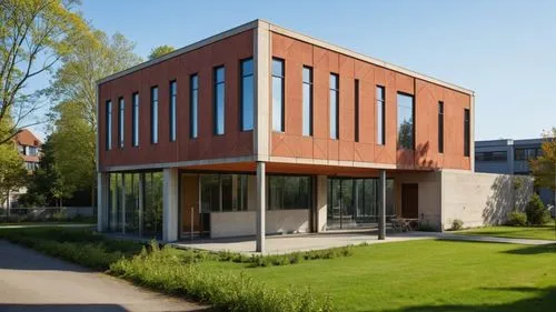 an orange and gray building on a sidewalk next to trees,radboud,hogeschool,natolin,house hevelius,rijksakademie,passivhaus,Photography,General,Realistic