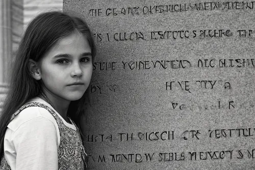 Create a short story about a young girl who discovers a hidden message engraved on the Lincoln monument.,tombstone,children's grave,stone tablets,abraham lincoln memorial,headstone,girl in a historic 