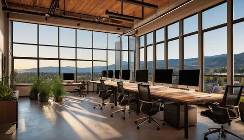 Modern architectural design firm, glass and steel skyscraper, downtown CDA Idaho, urban cityscape, night scene, warm lighting, floor-to-ceiling windows, minimalist interior, sleek wooden desks, ergono