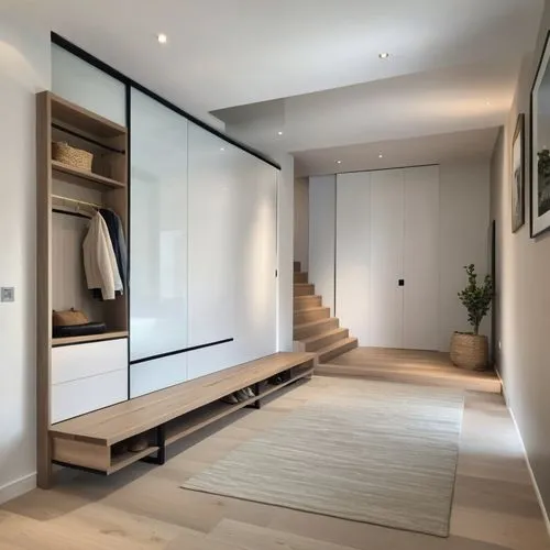 A modern and minimalist entryway measuring 4 meters long by 2.5 meters wide. The space features a built-in wardrobe that provides ample storage while maintaining a sleek appearance. Next to the wardro