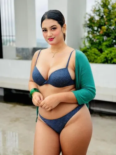 a woman in a blue bikini standing,astacio,salvadorian,venezolana,gorda,panamanian,guelaguetza