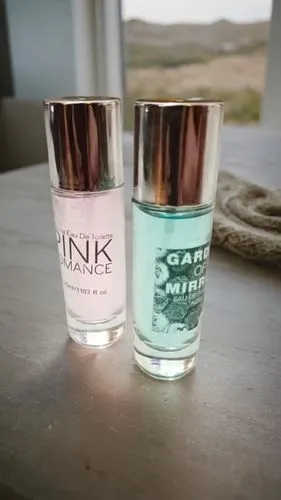 two bottles sitting on a wooden table next to each other,clink glasses,salt glasses,ginandjar,cocktail glasses,eriskay,pinkwater