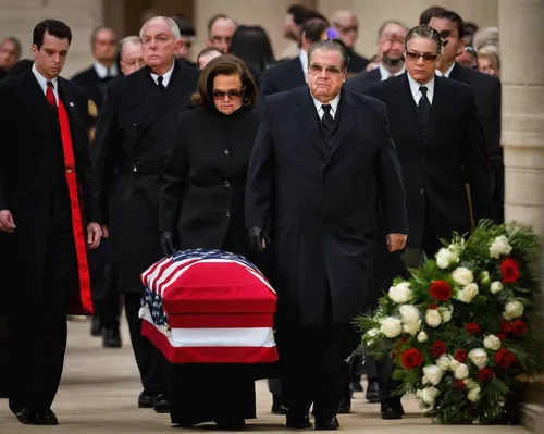 . Maureen McCarthy Scalia (C), follows her husband\'s casket as it is lead out of church after the funeral Mass for US Supreme Court Justice Antonin Scalia at the Basilica of the National Shrine of th