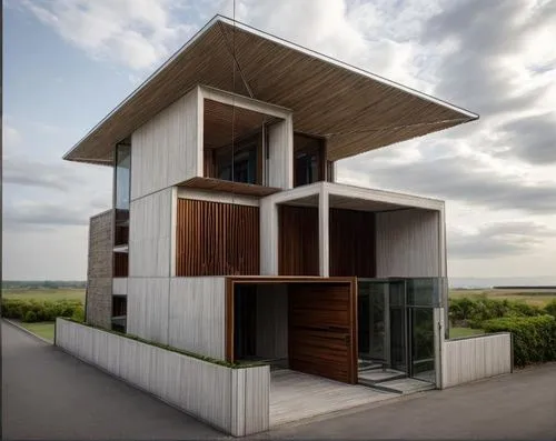 The modern villa is the fusion of vernacular keral cpncept using bricks and modern flar roof. it has vertival louveres and big glazed window and car porch... well defined entrance with steps. the site