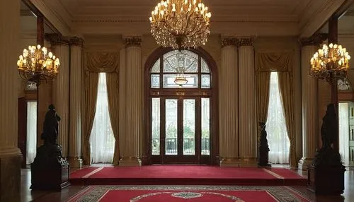 Grand, classical American federal architecture building, white columns, intricately carved wooden doors, ornate bronze door handles, symmetrical facade, grand staircase with red carpet, luxurious chan