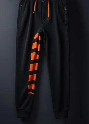 With black and dark orange ,the black and orange striped sweatpants are sitting on a gray surface,tracksuit,sweatsuit,tracksuits,sweatpants,onesie,sweatsuits,Photography,General,Realistic