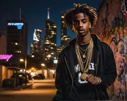 Young black male rapper, 24 years old, Playboi Carti style, trendy streetwear, bold gold chain, sleek afro hair, confident facial expression, microphone in hand, dynamic pose, urban cityscape backgrou