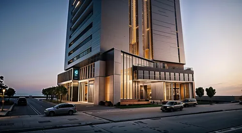 a building on a street with cars parked in front of it,rotana,piramal,largest hotel in dubai,ajman,bahria,omantel