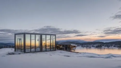 mirror house in the mountains,mirror house,finnish lapland,water cube,frozen lake,cube stilt houses,cubic house,ice hotel,snowhotel,winter house,winter lake,the polar circle,glass building,inverted co