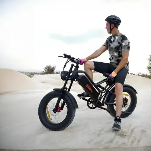 a man on an electric bicycle in a desert,bmx,e bike,stabilisers,bmxer,unicycling,minibike