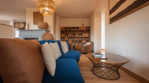 the couch in the living room is blue,appartement,shared apartment,smartsuite,home interior,contemporary decor,modern room,anastassiades,appartment,casa fuster hotel,guestroom,apartment,maisonette,inve