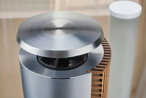 silver metal object on top of wooden table,digital bi-amp powered loudspeaker,beautiful speaker,humidifier,dehumidifier,coffee grinder,loudspeaker,Photography,General,Realistic