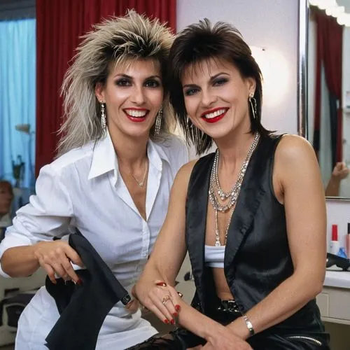 Close portrait. View of attractive rich very elegant laughing italian women with hairstyle 1980s style C C Catch,  looking straight into eyes, caressing bare upper arms, sitting in the chair and cross