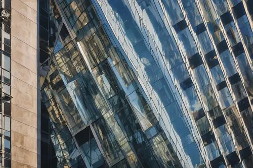 Modern skyscraper, sleek glass facade, steel frame, angular lines, minimalist design, urban cityscape, busy street, morning sunlight, subtle reflections, vertical windows, LED lighting, metallic mater