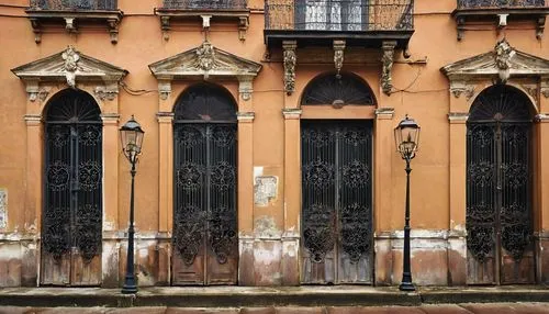 Old, worn, historic architectural salvage, New Orleans, Louisiana, French Quarter, vintage wooden doors, ornate iron gates, rusty metal lanterns, distressed brick walls, crumbling stone columns, faded