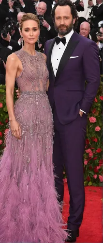 Goddess: Keri's gown was a rose mauve hue with feathers, beaded and embroidered details; pictured with her longtime partner Matthew Rhys,trash the dres,singer and actress,eurythmics,lampranthus,queen 