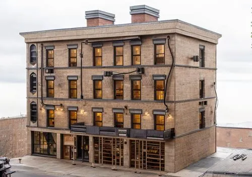 Typical New York colonial building, made of dark brick and stone and cement. At the bottom there are yellow scaffolding.,tenement,old town house,peat house,207st,built in 1929,boutique hotel,multi-sto