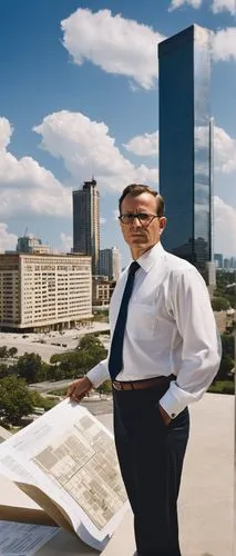 Middle-aged man, architect, standing, confident posture, black-rimmed glasses, short brown hair, slight beard, formal attire, white shirt, dark blue tie, light brown suit, holding blueprints, pointing