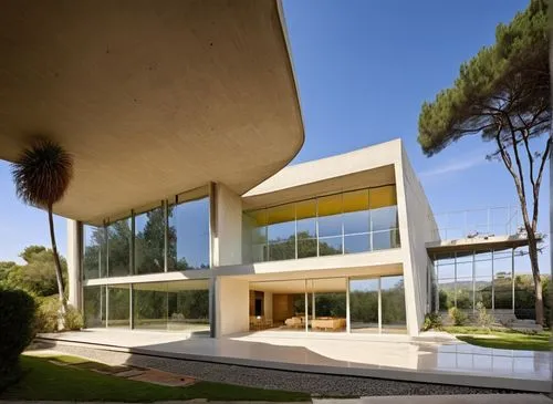 In a spacious masterful study, a minimalist house with a minimalist style exudes relaxation and beauty. The facade of the house is adorned with intricate concrete facades and plush carpet, with polish