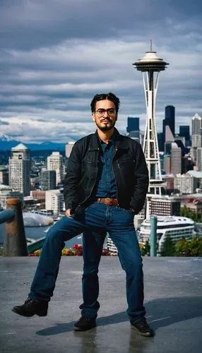 Seattle, male photographer, 30s, short beard, messy hair, glasses, casual wear, jeans, black jacket, camera in hand, tripod nearby, cityscape, skyscrapers, Space Needle, Puget Sound, ferry terminal, c