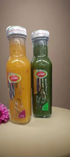 two bottles are full of juice and one is empty,vegetable juices,fruit and vegetable juice,vegetable juice,juicing,fruit juice,juices