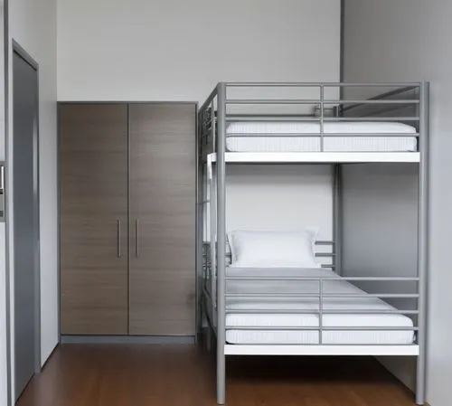 a metal bunk bed in a very small room,bunkbeds,schrank,bunk bed,walk-in closet,bunks,bunk beds,Photography,General,Realistic