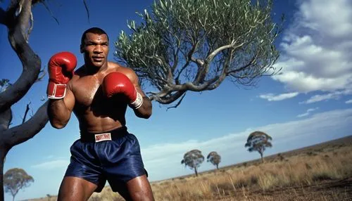 Mike Tyson, boxing champion, muscular build, intense facial expression, sweat-drenched skin, red boxing gloves, black trunks, boots, fierce punch, powerful kick, kangaroo, Australian outback, sunny da