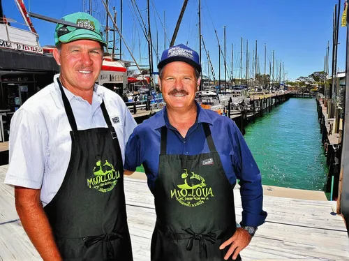 SHIP SHAPE: Trevor Hohns and his son Andrew at their new business venture in Mooloolaba, Pier 33.,commercial fishing,fishermans wharf,yellowtail amberjack,boats and boating--equipment and supplies,cra