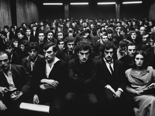 In a dystopian future, describe a rebel leader's intense Kubrick stare that sparks hope in their followers.,audience,the conference,the crowd,crowded,crowd of people,crowd,concert crowd,group of peopl