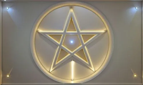 Gypsum decoration in the ceiling of a room with hidden LED lighting the ceiling,an illuminated star that appears to be on the side of a building,christ star,eckankar,circular star shield,star of david