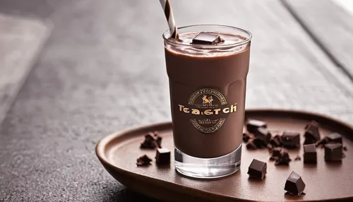 Describe the comforting taste of chocolate milk on a rainy day.,chocolate smoothie,chocolate-covered coffee bean,lassi,chocolate hazelnut,coffee tumbler,chocolatemilk,liqueur coffee,chocolate-coated p