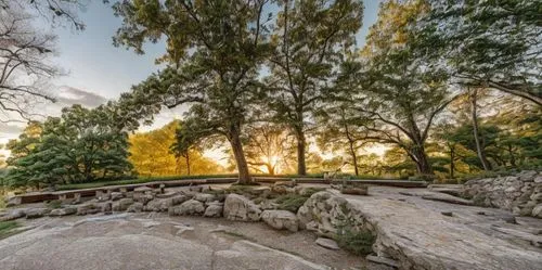 The photograph takes center stage, showcasing a quaint and minimalist design. The frame is a serene representation of a large, rectangular block in the shape of a pillar, surrounded by vibrant stonewo