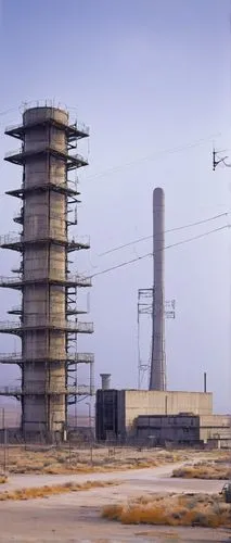 Nuclear power plant, futuristic, industrial architecture, concrete structure, steel beams, warning signs, radiation symbols, barbed wire fencing, isolated location, desert landscape, abandoned surroun